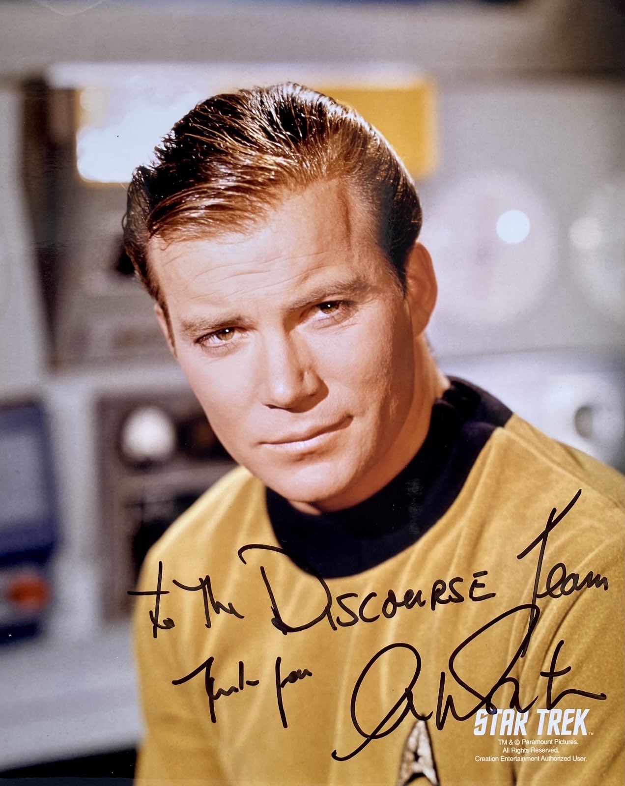 Photo of William Shatner as Kirk in Star Trek, signed "to the Discourse Team, thanks from Shatner"