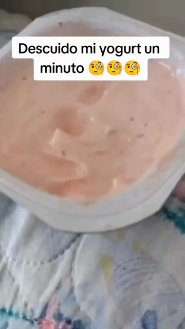 [Video shows a cup of strawberry yogurt with an indentation in the middle]

Descuido mi yogurt un minuto 🧐🧐🧐
(I neglect my yogurt for a minute)

[Video pans to a black cat licking the huge globs of yogurt off its messy, yogurt-filled face]

No me arrepiento Karen..😻 
(I do not regret it Karen..)