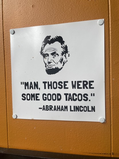 Photo of a pinned paper with a drawing of Abraham Lincoln and the following quote:

"Man, those are some good tacos."
–Abraham Lincoln
