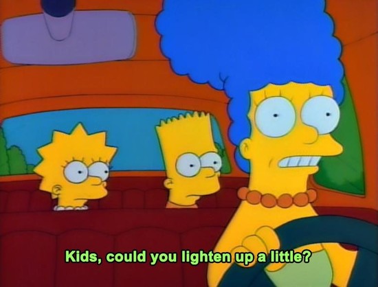 The image depicts a scene from the animated television show "The Simpsons." In the foreground, a woman with blue hair and a large afro hairstyle is driving a car. She is wearing a green dress and a beaded necklace, and her expression is one of mild exasperation. In the backseat, two children are visible. The girl on the left has spiky yellow hair and is looking towards the driver with a concerned expression. The boy in the middle has short yellow hair and glasses, and he is also looking at the …