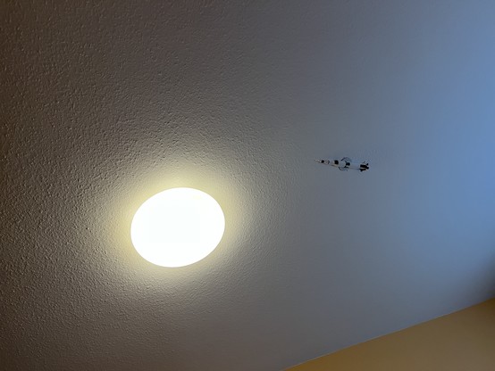 The same moon lamp. A small rocket can be seen attached to the magnetic mounting point. 