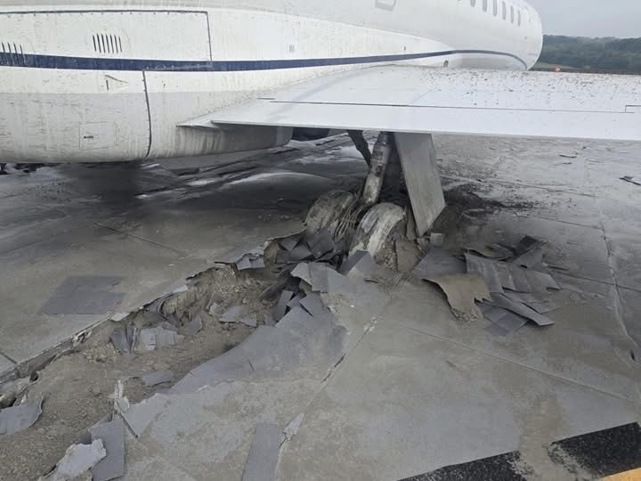 pic near the landing gear of the incident Embraer ERJ-145XR showing it buried in EMAS
