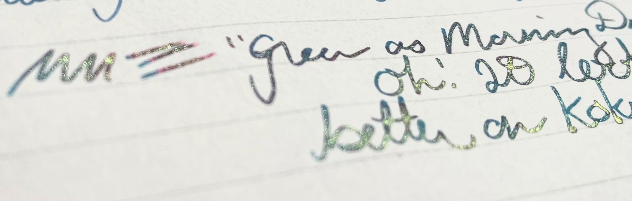 an angled close-up of writing on different paper that's all-around shinier with some successful gradient