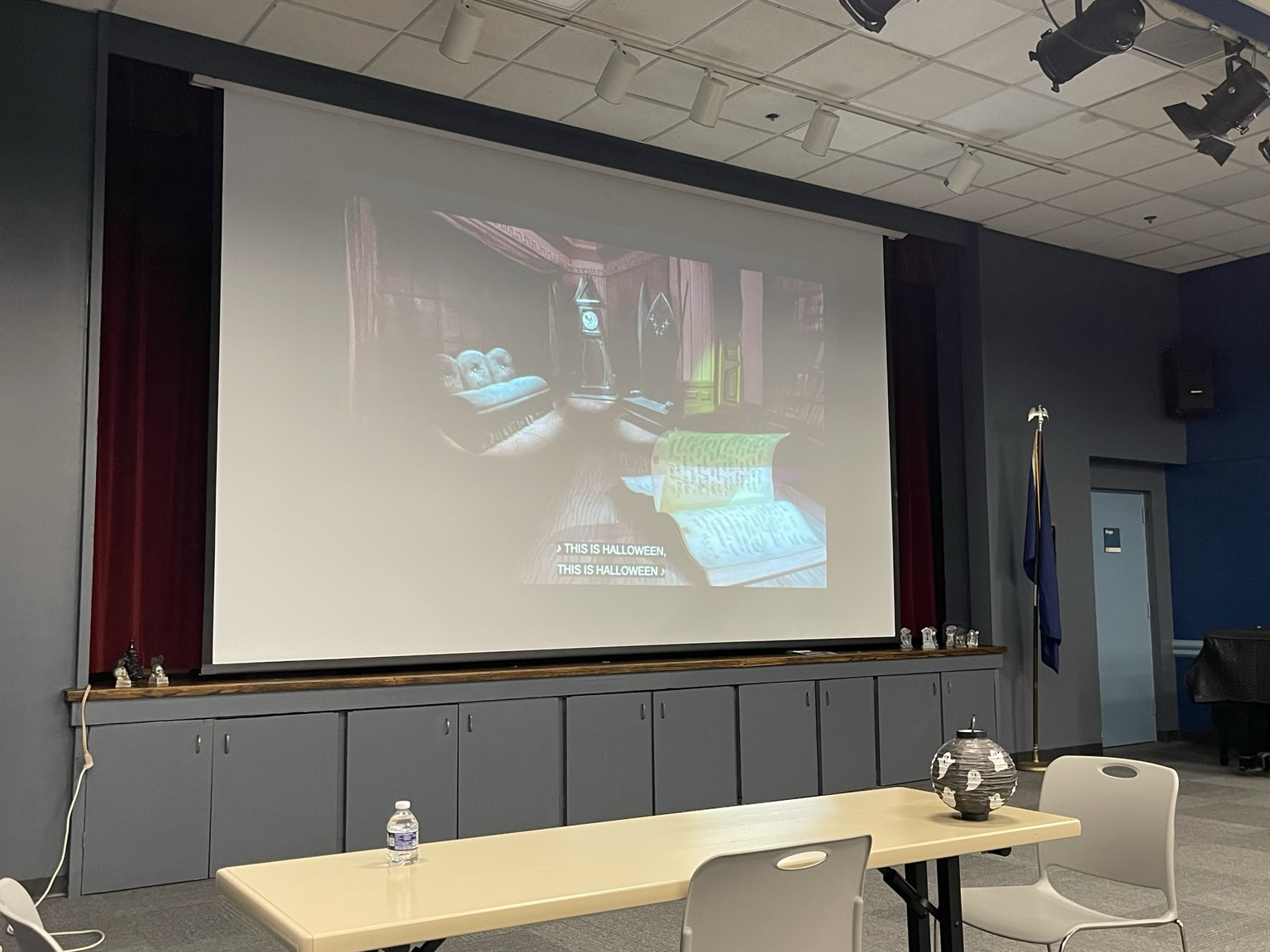 A movie screen playing Nightmare Before Christmas