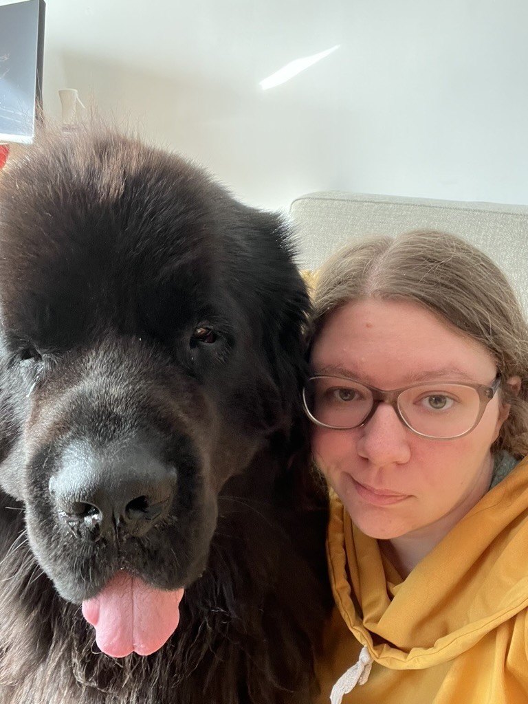 me (the human adult woman) sitting with Odin (who is bigger than me)
