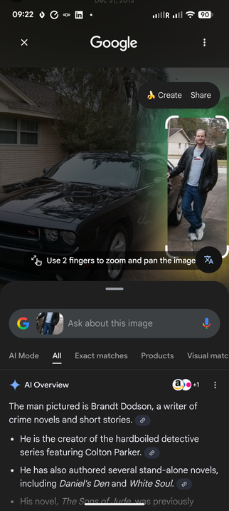 The image is a screenshot from a mobile phone displaying a Google search result. The main focus is on a photograph of a black Dodge Challenger car and a man standing next to it. The man is fair-skinned with short, brown hair and a beard. He is wearing a black leather jacket, a grey t-shirt with a Texas flag on it, blue jeans, and white sneakers. He is standing with his right arm resting on the car.

The car is a shiny black, and the image is slightly blurred. The background shows a house with b…