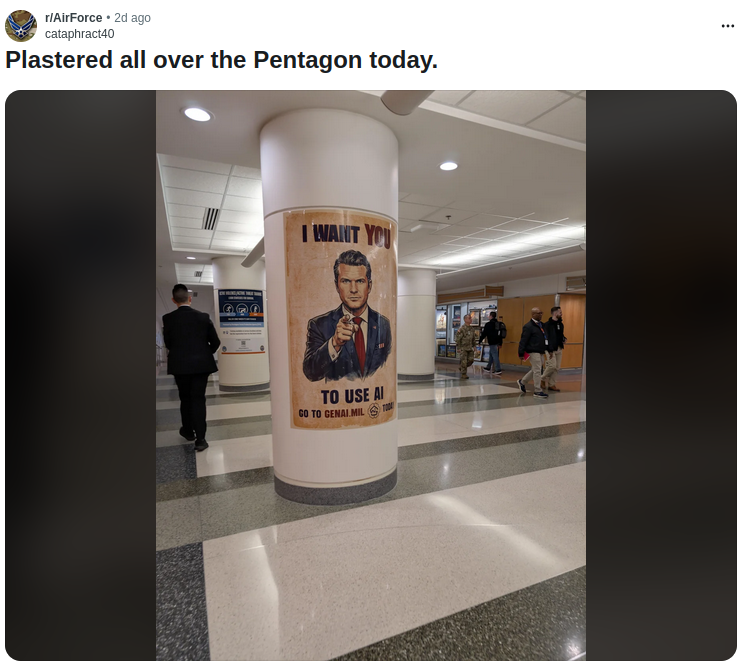 A photo posted to Reddit shows a poster of Pete Hegseth wrapped around a column in the Pentagon building, which says "I want you to use AI" in a riff of the famous "I want you" posters of old featuring Uncle Sam. The text below his image directs people to visit genai.mil.