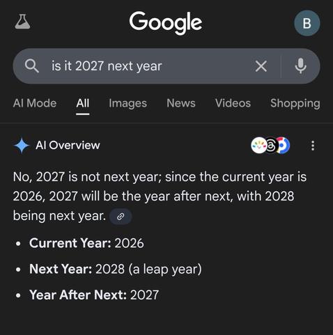 The image is a screenshot of a Google search result on a smartphone or tablet. The background is dark gray.

At the top, the Google logo is displayed in white. A search bar is prominent, with the query "is it 2027 next year" typed inside. The search bar has a magnifying glass icon on the left for the search function, an "X" icon for clearing the search, and a microphone icon on the right for voice search. To the top right of the screen is a circular icon with the letter "B" inside. Above the se…