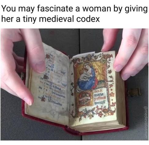 Caption: You may fascinate a woman by giving her a tiny medieval codex

Photo of someone opening a very small medieval codex with fancy medieval art, a red binding, and a clasp to secure it closed.