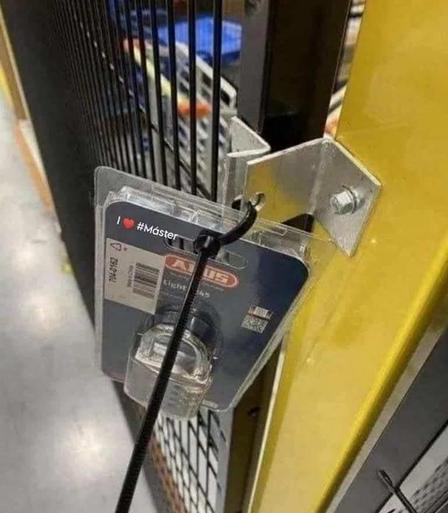Photo of a metal gate with a lock still in plastic store packaging just zip tied to the gate. This photo feels like an analogy, and the phrase "we care about your private" comes to mind...