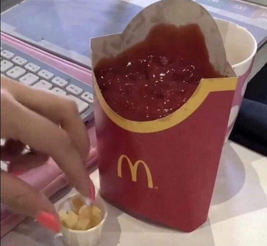 Fry's container full of ketchup