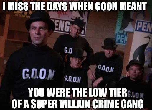 The image is a meme featuring a group of men in black turtlenecks and bowler hats. They are standing in what appears to be a dimly lit room with some posters on the wall. The men are all wearing shirts with the word "GOON" printed on them in white letters, some with periods between the letters (G.O.O.N.) and some without.

The posters in the background are partially visible and appear to be of a vintage style. One poster shows the word "ENG" in large letters and another shows "PEN" repeated. Th…