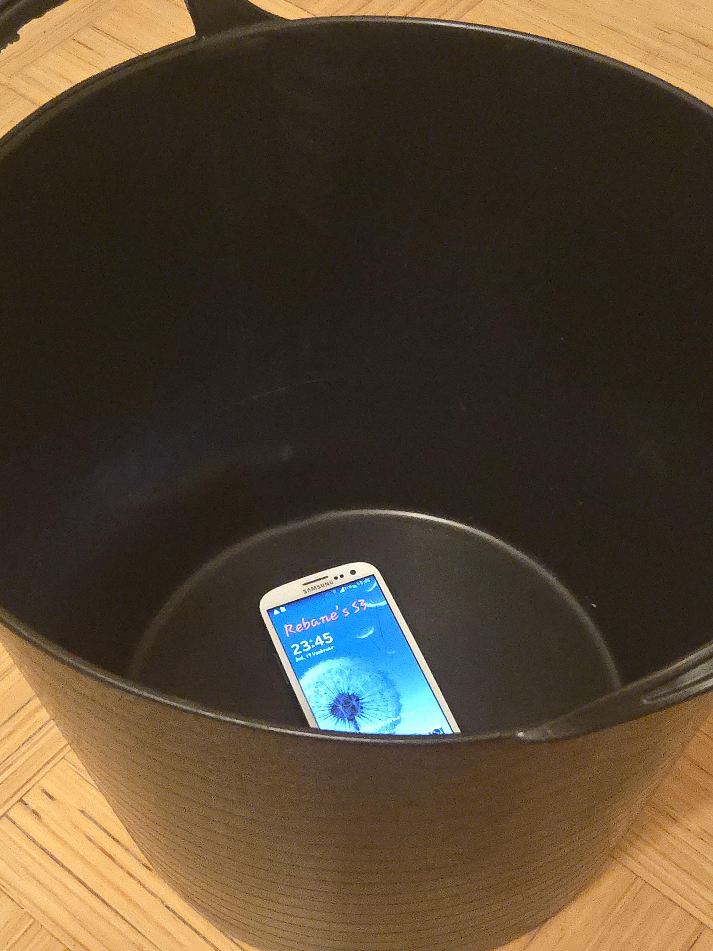 A physical bucket with the Samsung Galaxy S3 phone in it