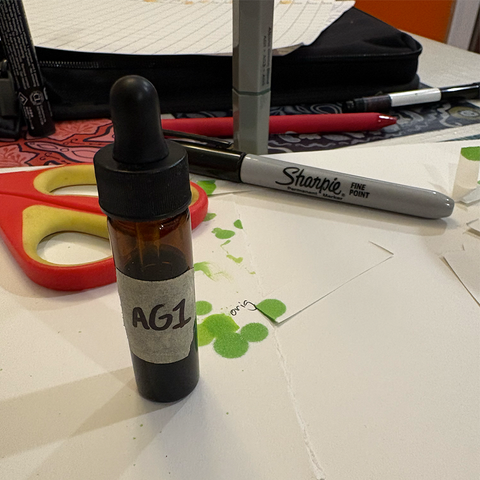 labeled glass bottle on table