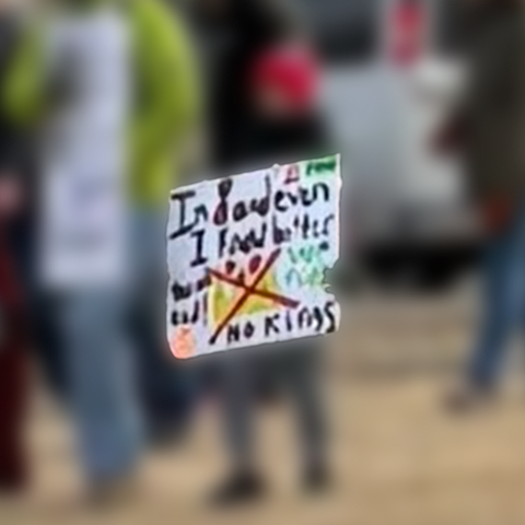 a sign saying “I’m eight and even I know better”