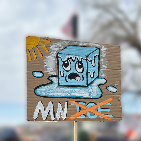 An ice cube melting “MN ICE” with “ICE” crossed out