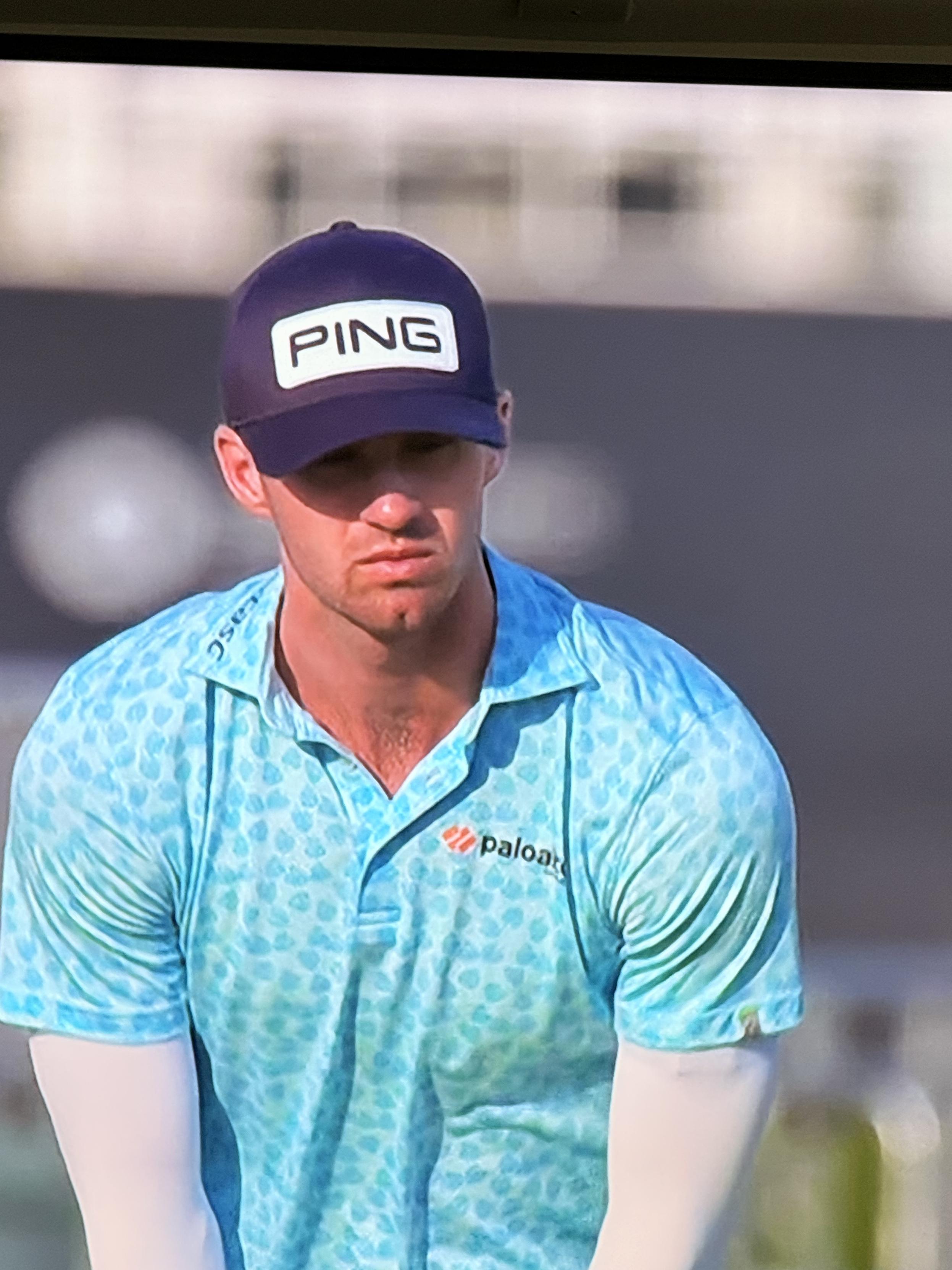 a golf man who i dont know wearing a hat that says ping