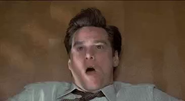 Animated gif on Jim Carrey in Liar Liar.  Jim is lying on the floor and he covers up his mouth to stop being to truthful.