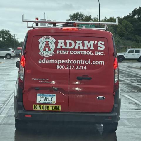 Adam's Pest Control van with 'CYAFLY' license plate