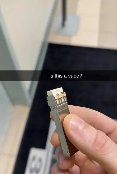 Image of a GBIC, overlayed with text "Is this a vape?"