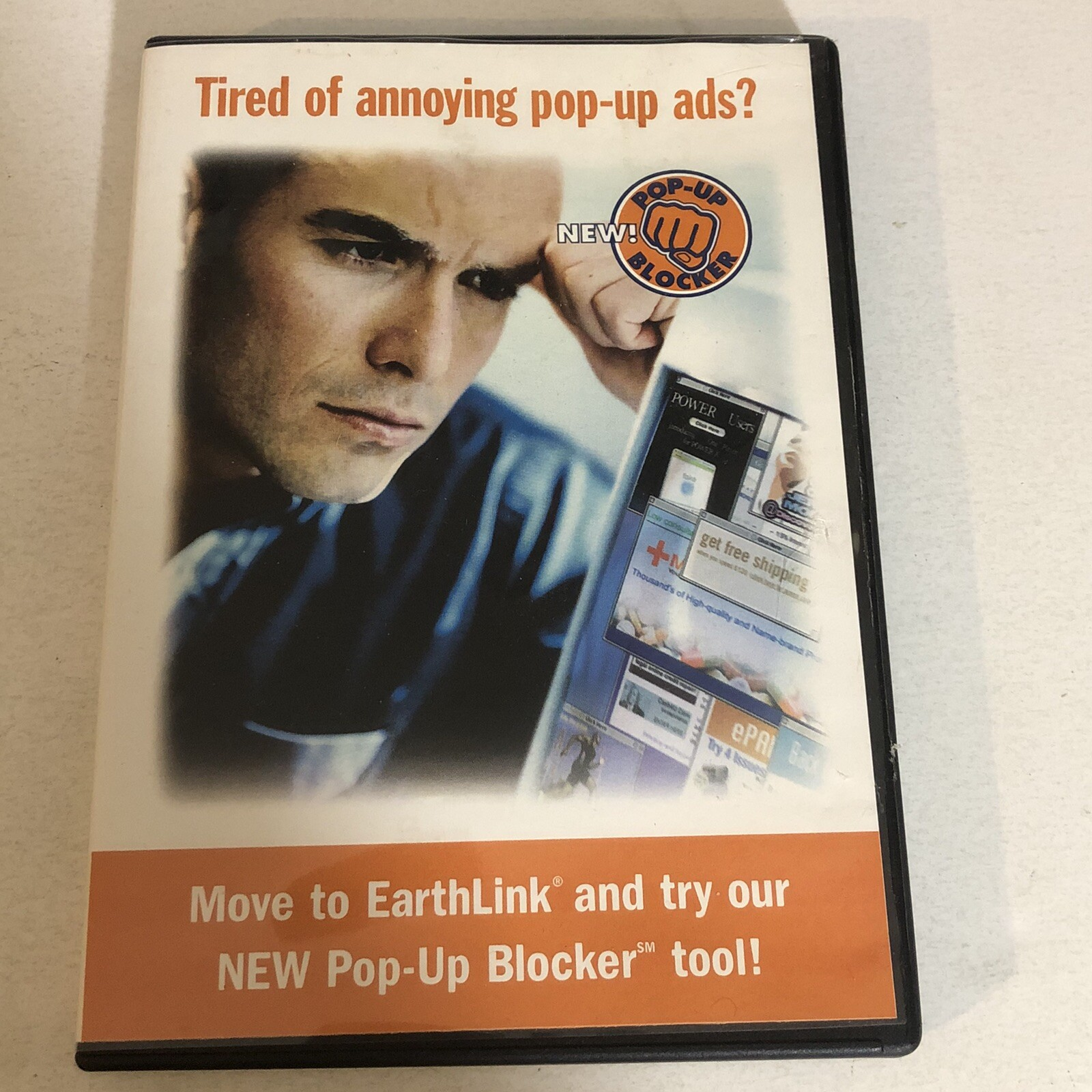 front cover of the CD case for some version of Earthlink Internet Dialup server.  The Cover asks if the user is Tired of Annoying Pop Up Ads and says to Move To Erthlink and try our NEW Pop Up Blocker Tool.  A Caucasian male is resting his temple on the knuckles of his fist to give the appearance of concerned thinking.