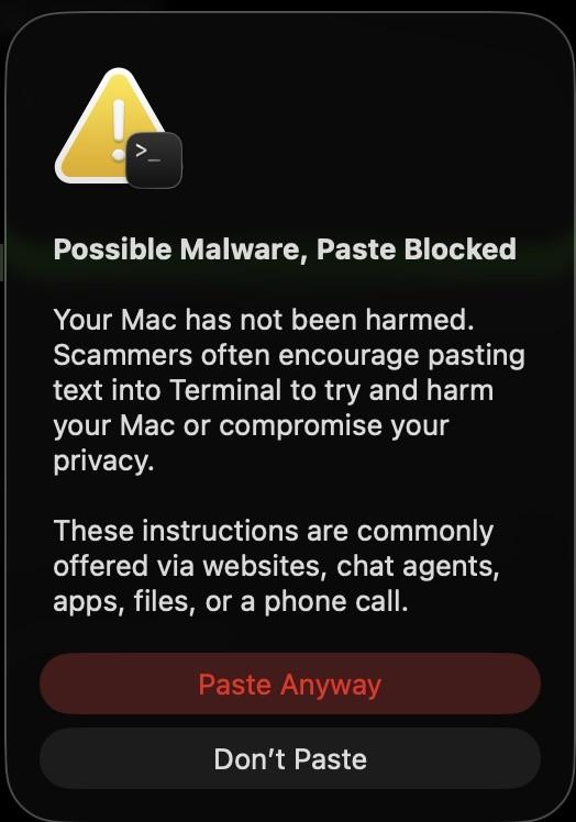 A warning notification on a Mac screen indicates a possible malware threat. It states that pasting text into Terminal has been blocked to protect the user from potential scams. The message reassures that the Mac is unharmed and lists common methods scammers use to deliver