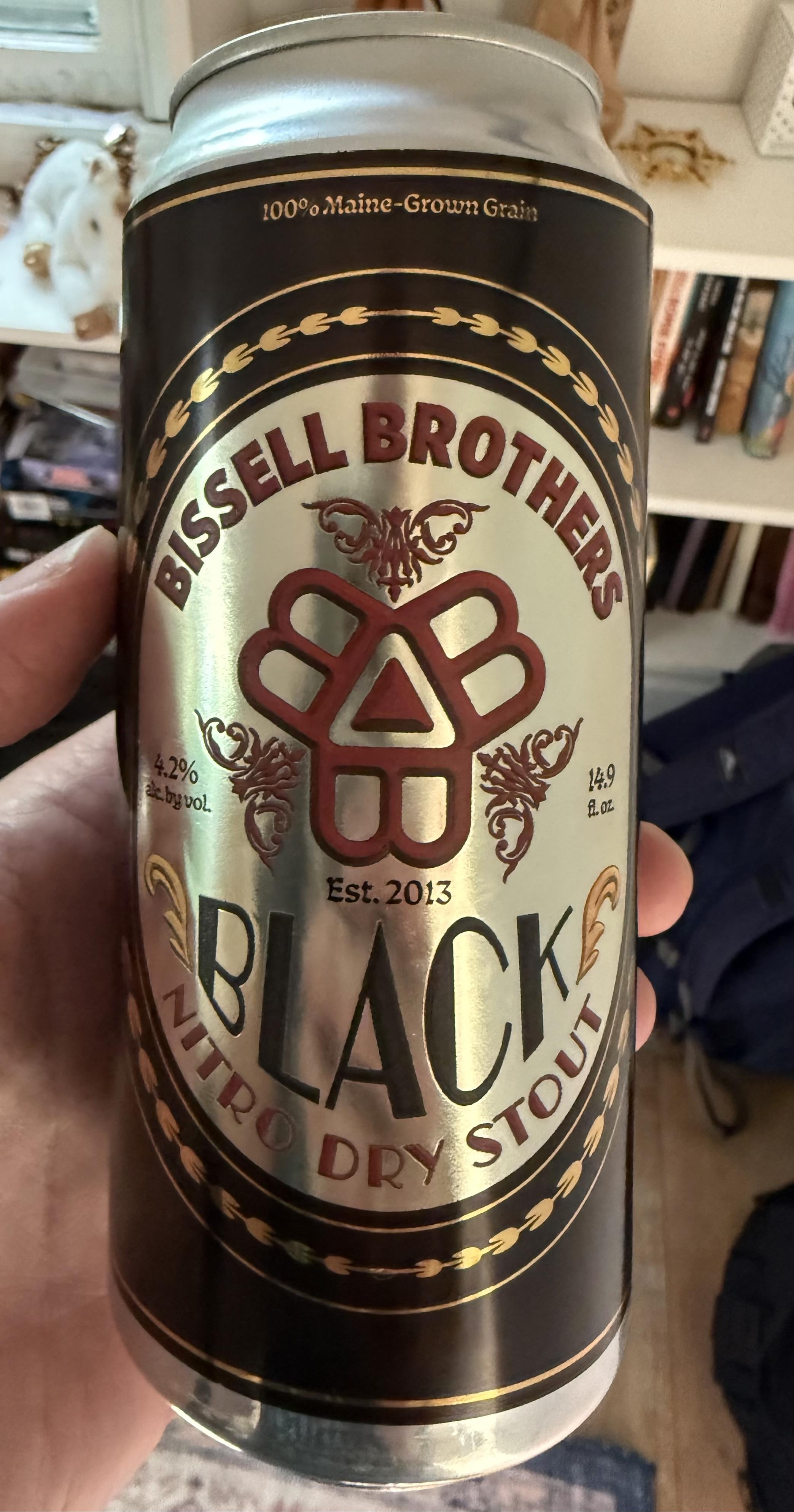 A pint can has a black and gold and red label. At the center are three conjoined “B”s with a triangle in the middle, the logo of Bissell Brothers