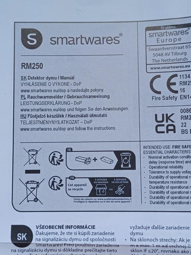 Photo of part of a smoke detector user manual in Slovak, Polish, and Hungarian (ostensibly).

(S) smartwares
RM250

SK Detektor dymu / Manuál
VYHLÁSENIE O VÝKONE - DoP
www.smartwares.eu/dop a nasledujte pokyny.

PL Rauchwarnmelder / Gebrauchsanweisung
LEISTUNGSERKLÄRUNG - DoP
www.smartwares.eu/dop und folgen Sie den Anweisungen.

HU Füstjelző készülék / Használati útmutató
TELJESÍTMÉNYNYILATKOZAT - DoP
www.smartwares.eu/dop and follow the instructions.