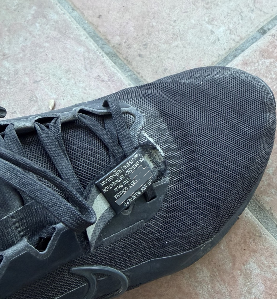 A photo of a RoadID shoe tag on a running shoe.