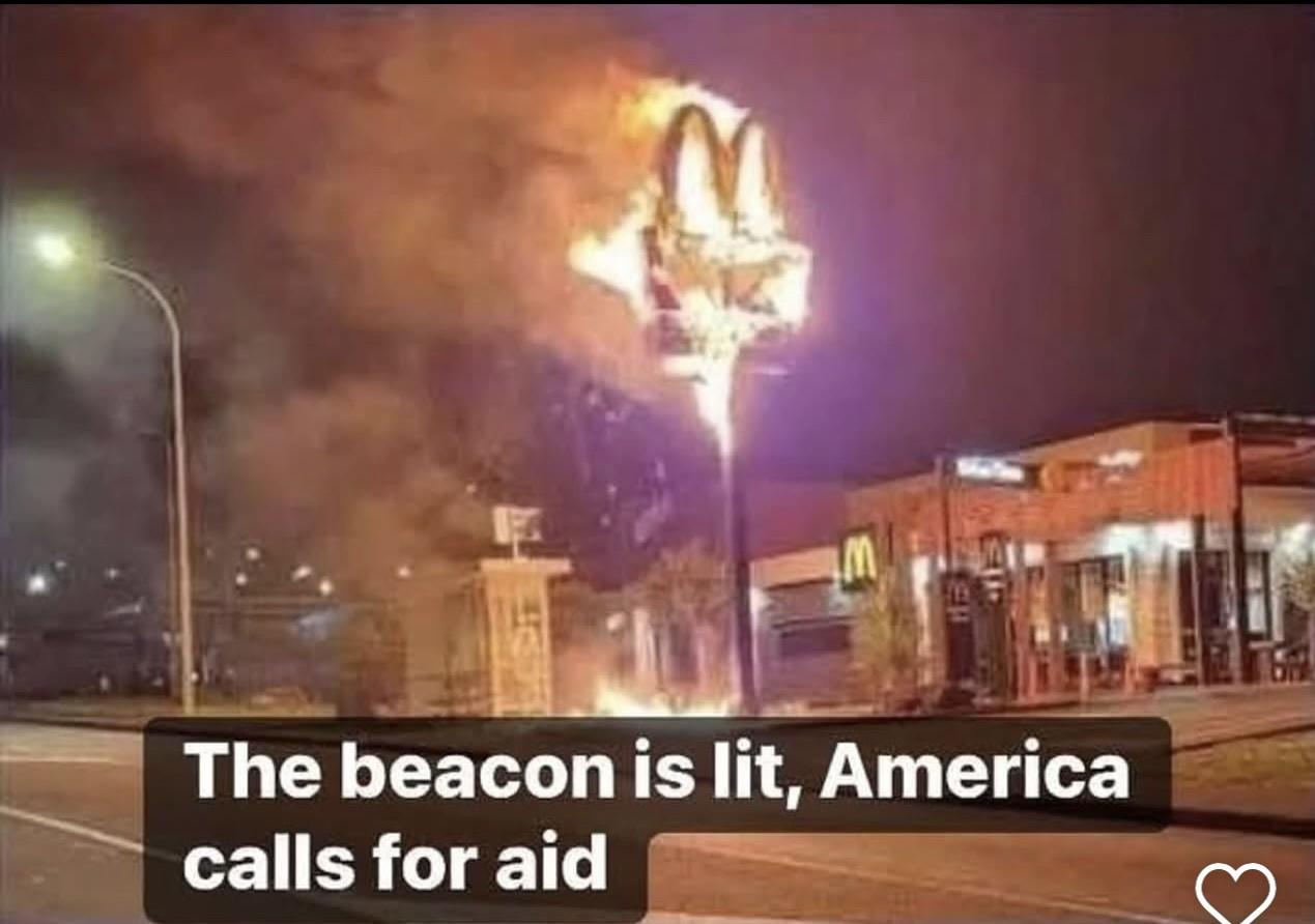 America has lit the beacons a lord of the rings reference as a McDonald's arches sign is burning.