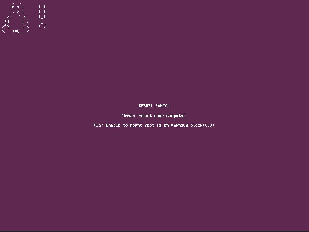 A stylized kernel panic error screen on a dark purple background, with a small ASCII-art cow/goat face in the top-left corner. Centered text reads 'KERNEL PANIC! Please reboot your computer. VFS: Unable to mount root fs on unknown-block(0,0).