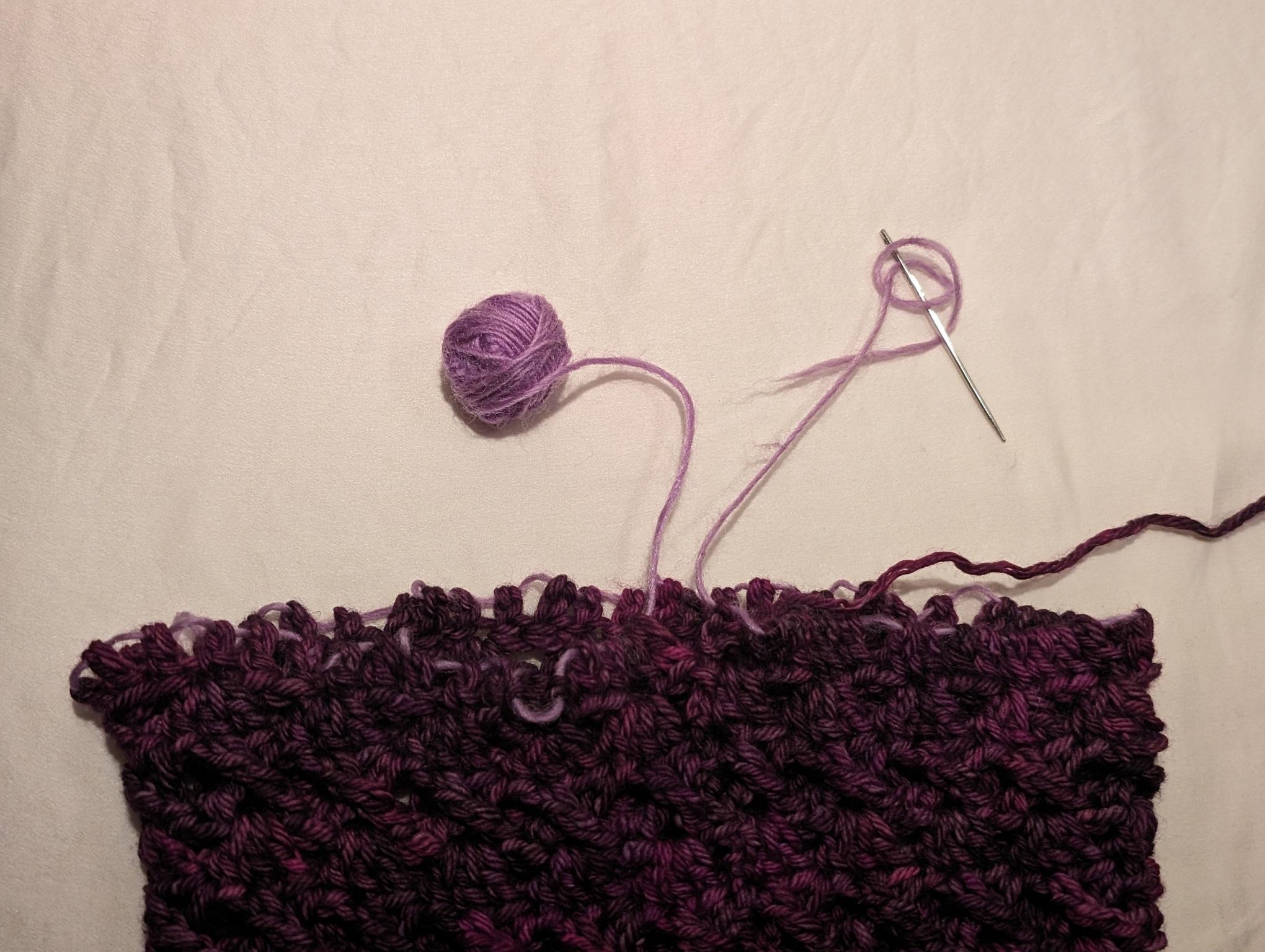 the foundation-chain-less cowl edge, with yarn threaded through all the double-crochets, waiting for me to figure out wtf to do next