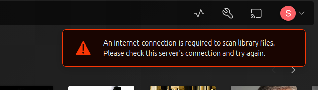 Error pop up in Plex Web App resulting from a scan of a music collection.  Red Triangle warning with an exclamation point next to white text that states "An internet connection is required to scan library files.  Please check this server's connection and try again."