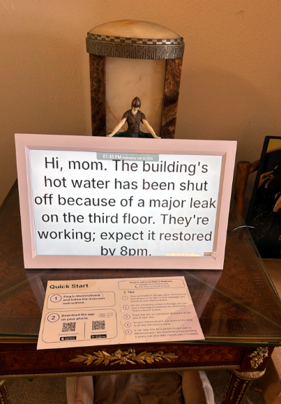 A Memory Board showing a message that the building's hot water has been shut off because of a leak and saying it will be restored at 8 pm.
