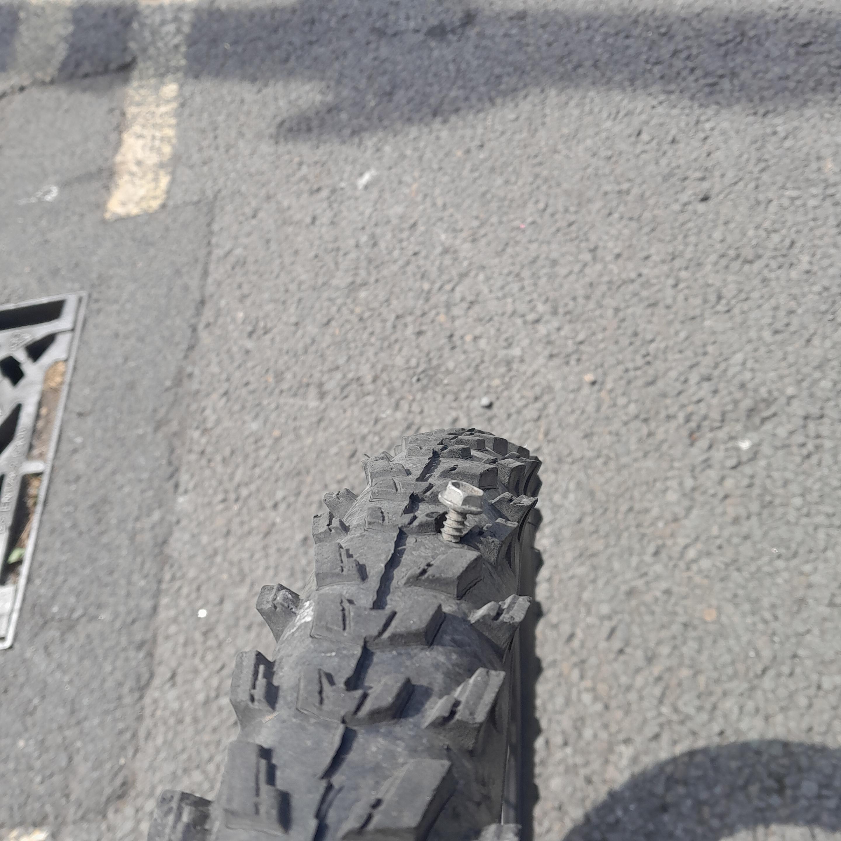 Yes, large screw in the front tire, will leave as is, serves as a plug.
