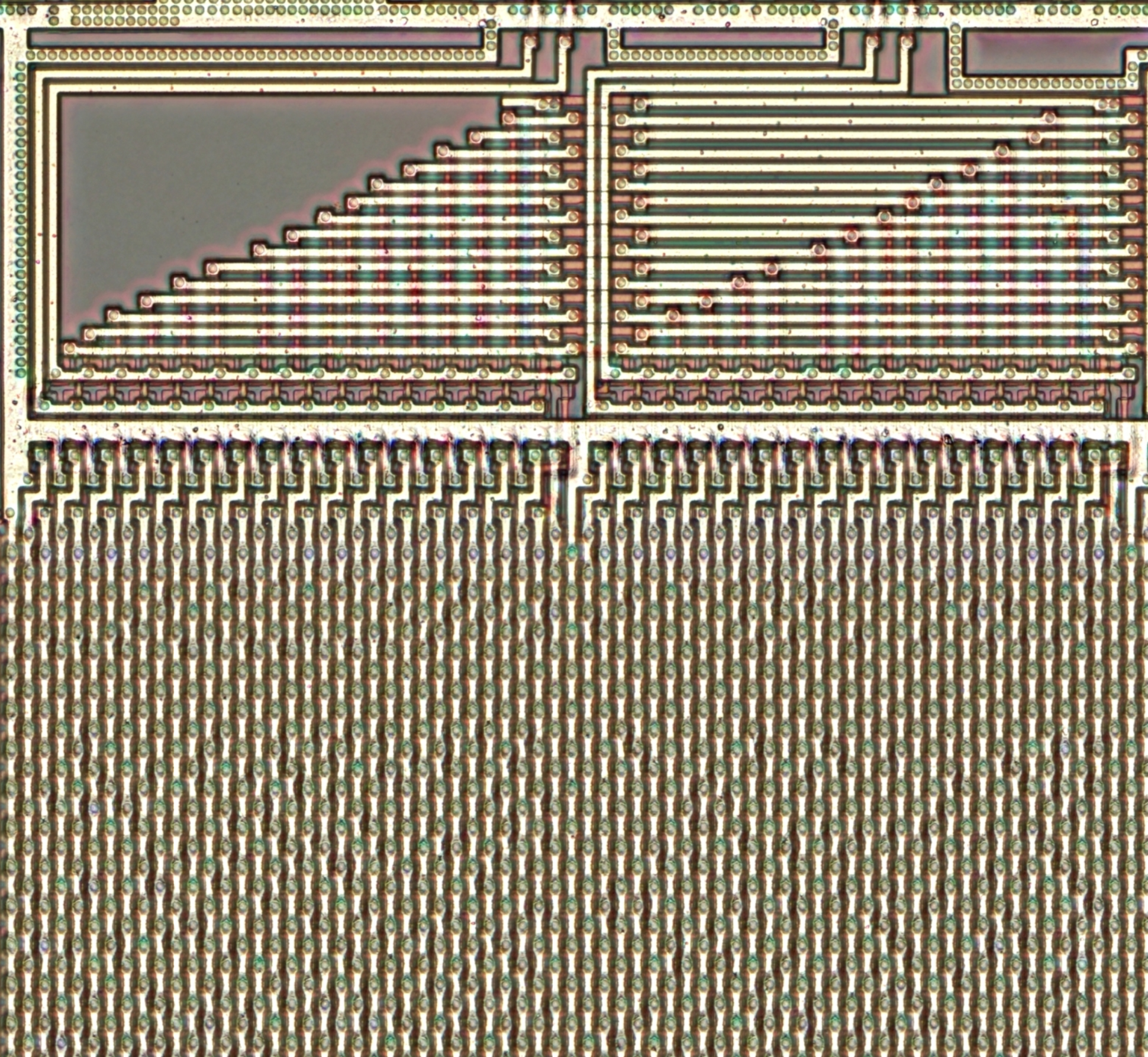Rows and rows of staggered vias. Bits are not immediately visible without stripping the metal layer.