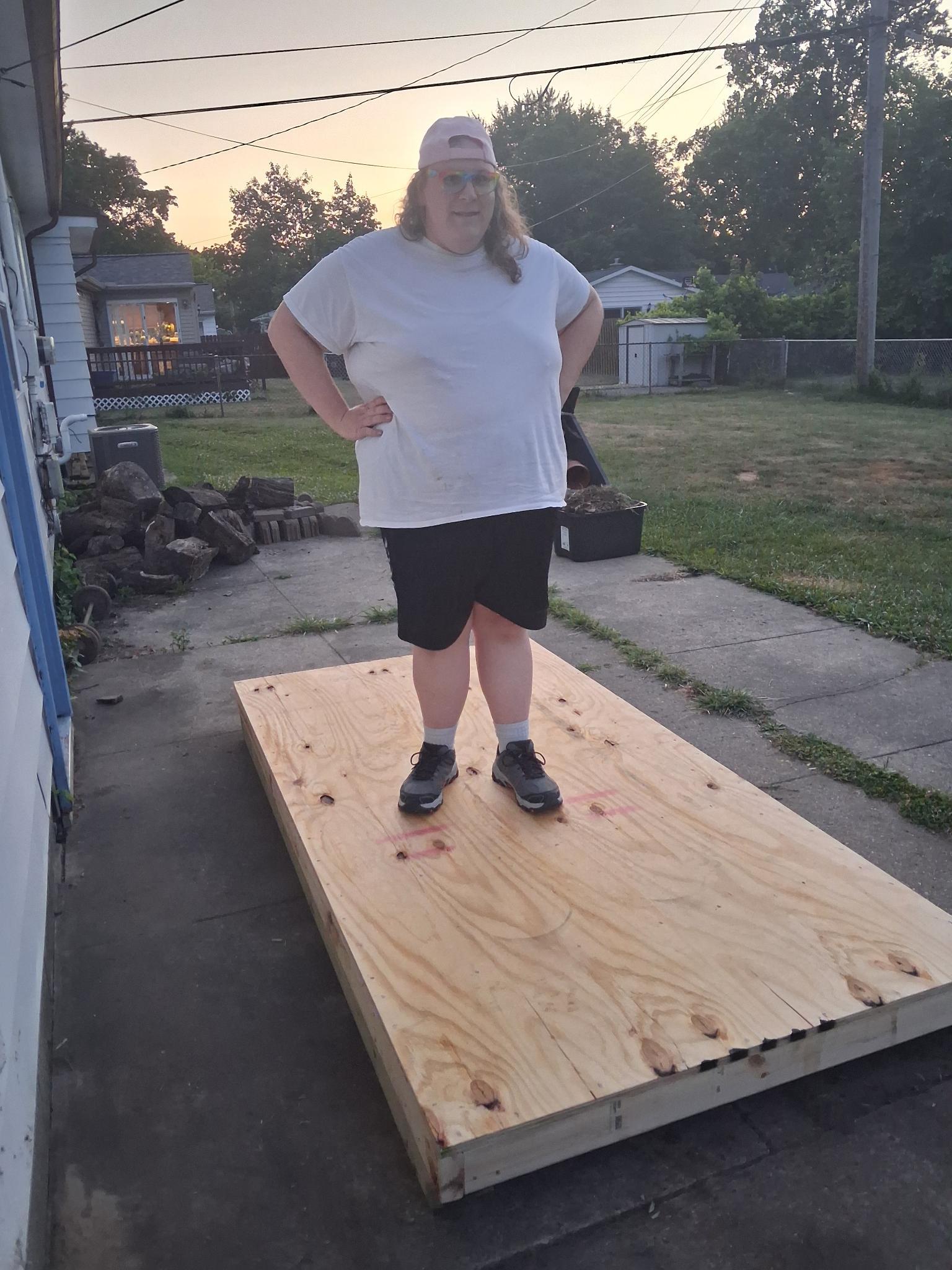 The same platform with a larger human being standing upon it to indicate its strength and stability. The platform, not the person.