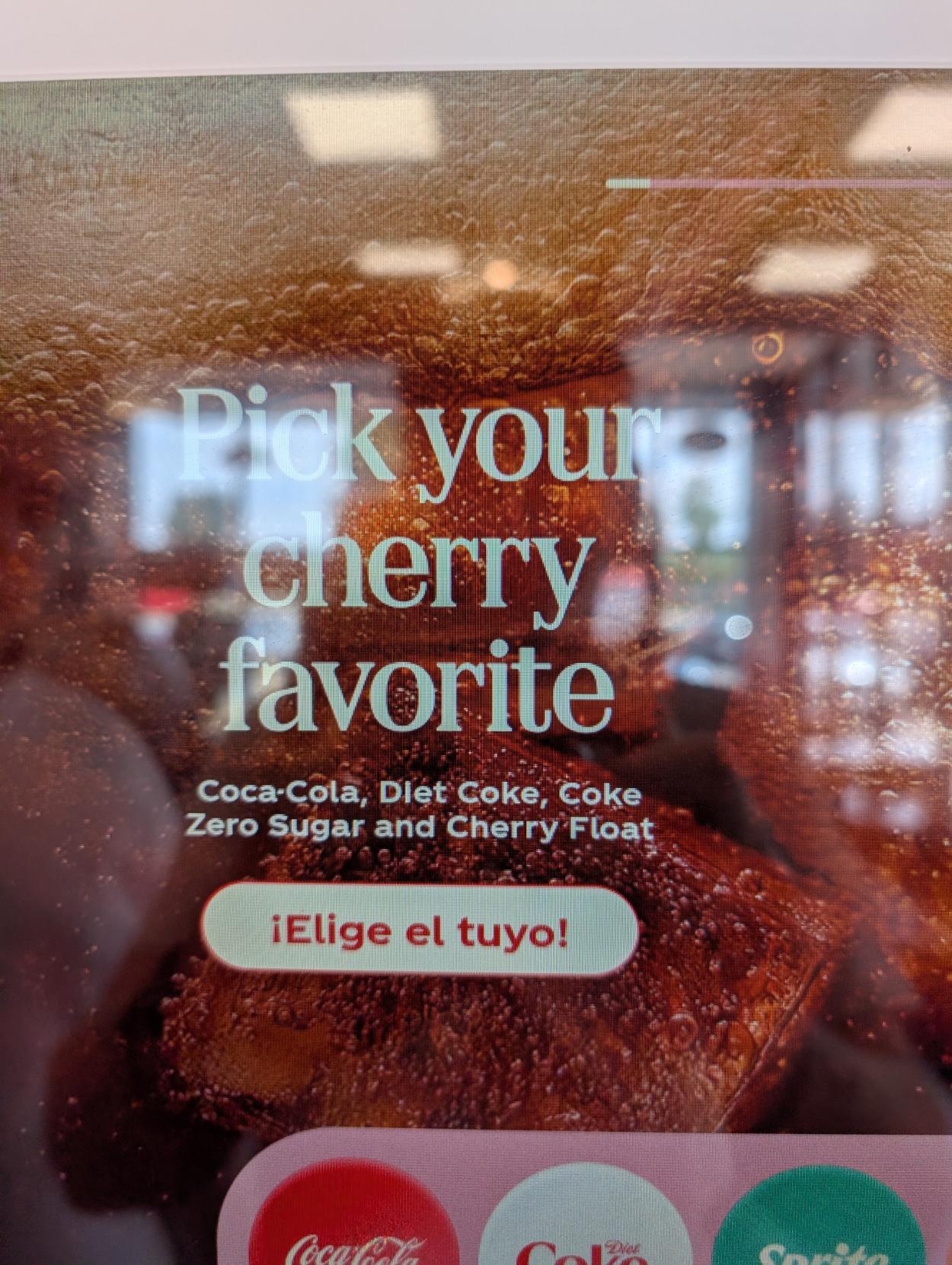 A computer controlled soda dispenser where part of the UI is in Spanish and the rest is in English.