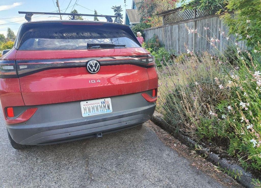 red car with washington license plat MWWMWMWMW or similar