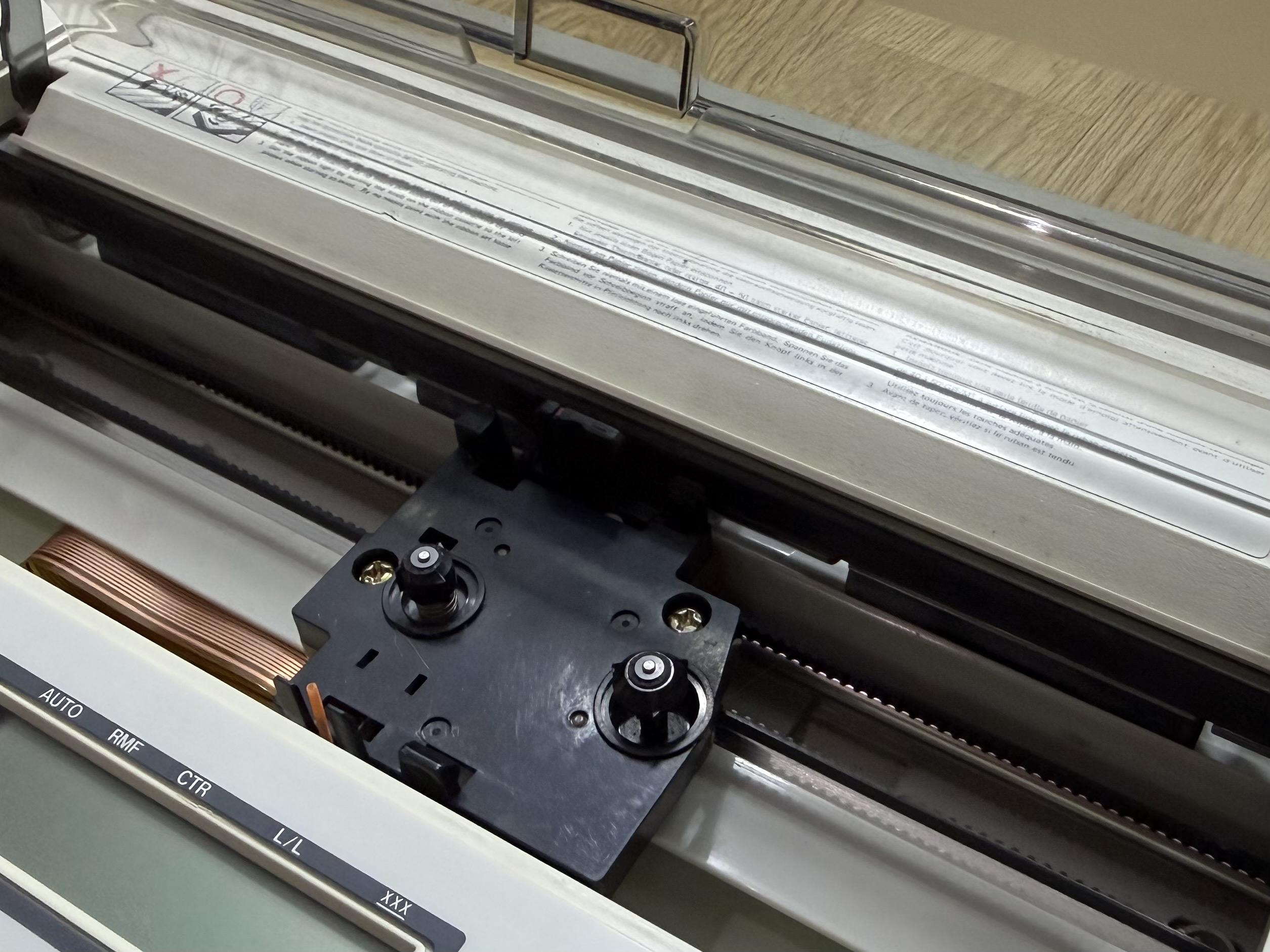 A close-up photograph of the printing mechanism of a Brother EP-44.