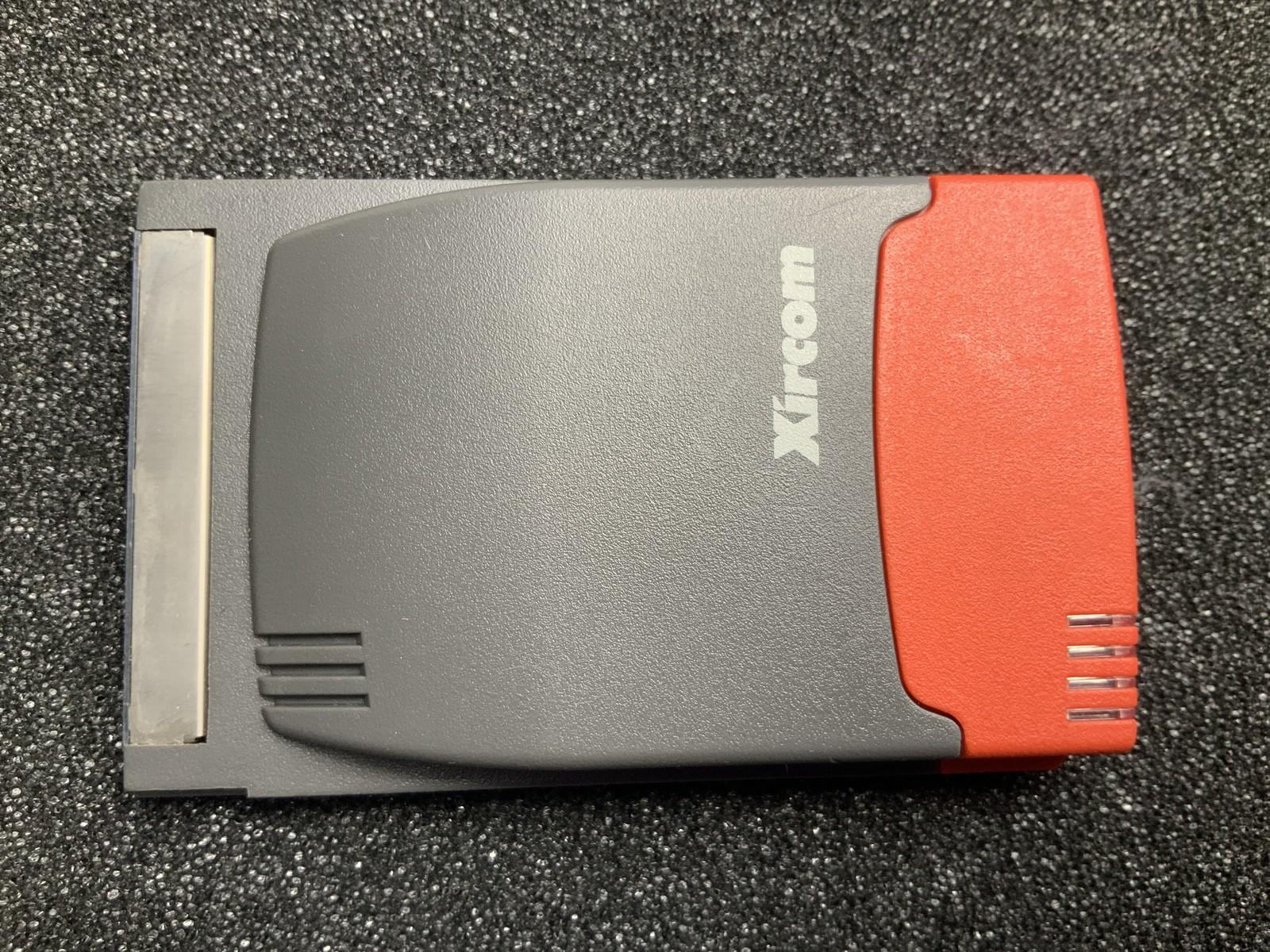 XIRCOM double height PCMCIA card with network and modem, ports are integrated to the card and do NOT stickout from the laptop case.