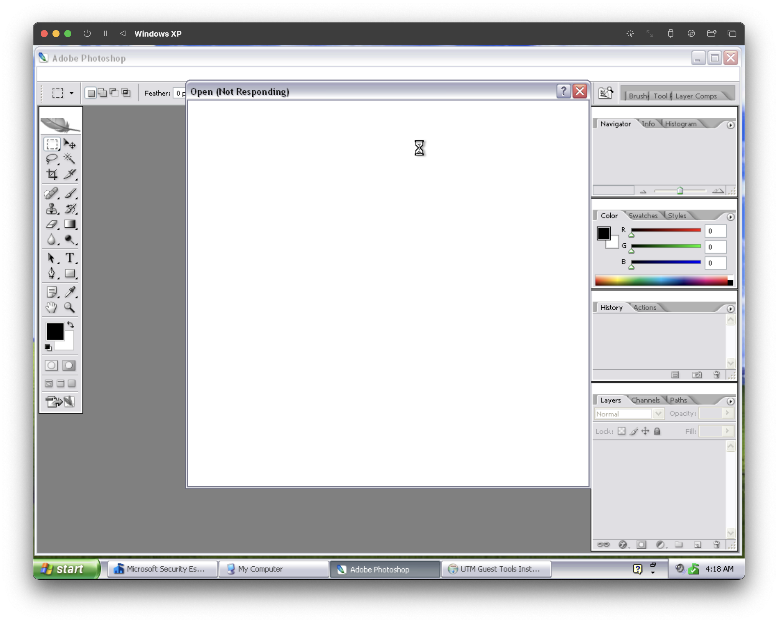 A screenshot of an emulated PC running Windows XP. It's using the silver theme, and running Photoshop in the foreground. The taskbar displays Security Essentials, My Computer, Adobe Photoshop, and UTM Guest Tools Installer. The Photoshop interface is covered by a blank Open dialogue box that is marked Not Responding.