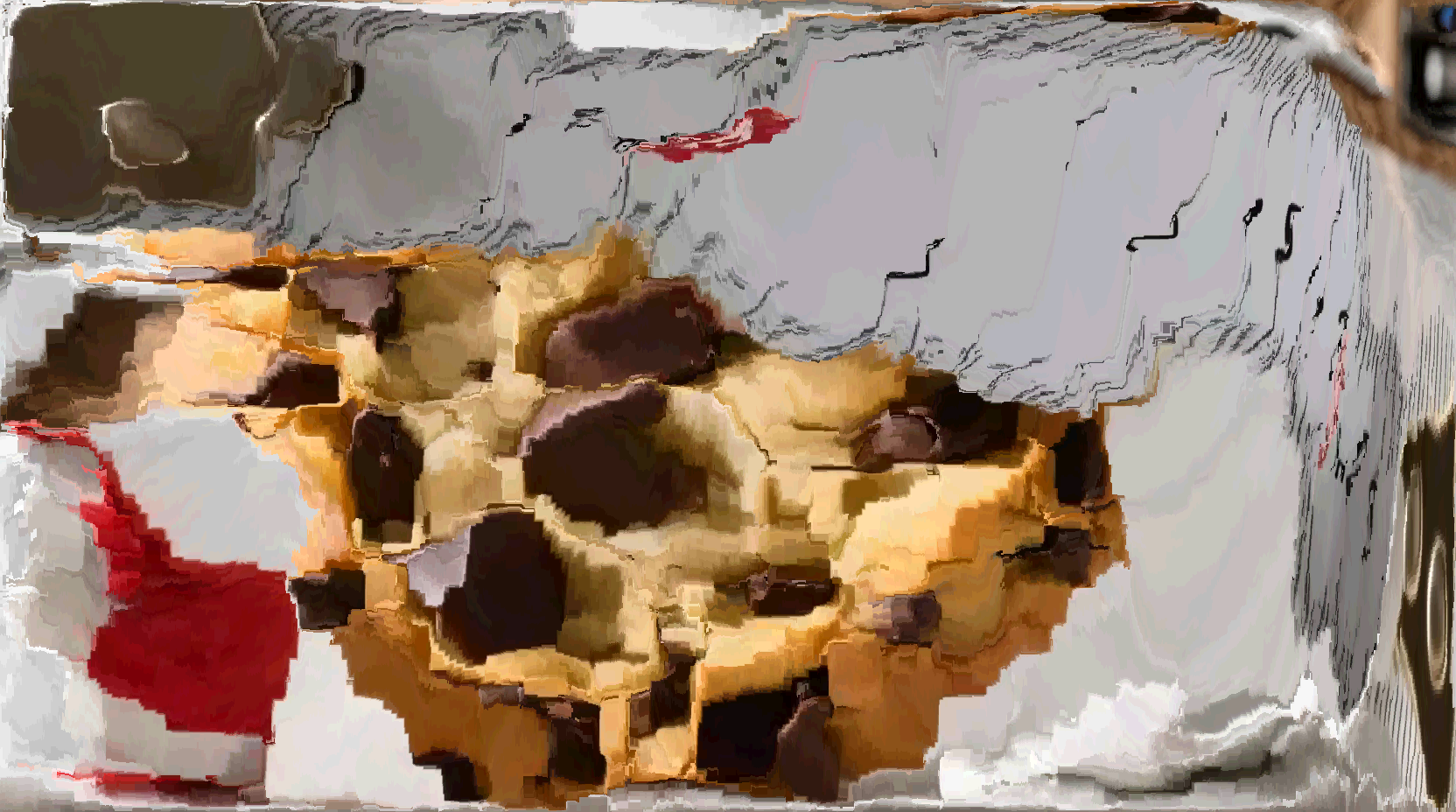 the same image but the ruler has been exaggerated at the expense of the cookie in the scaling up.
