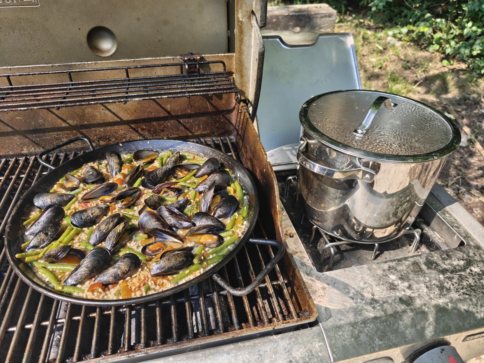 The paella constructed getting ready to cook down.