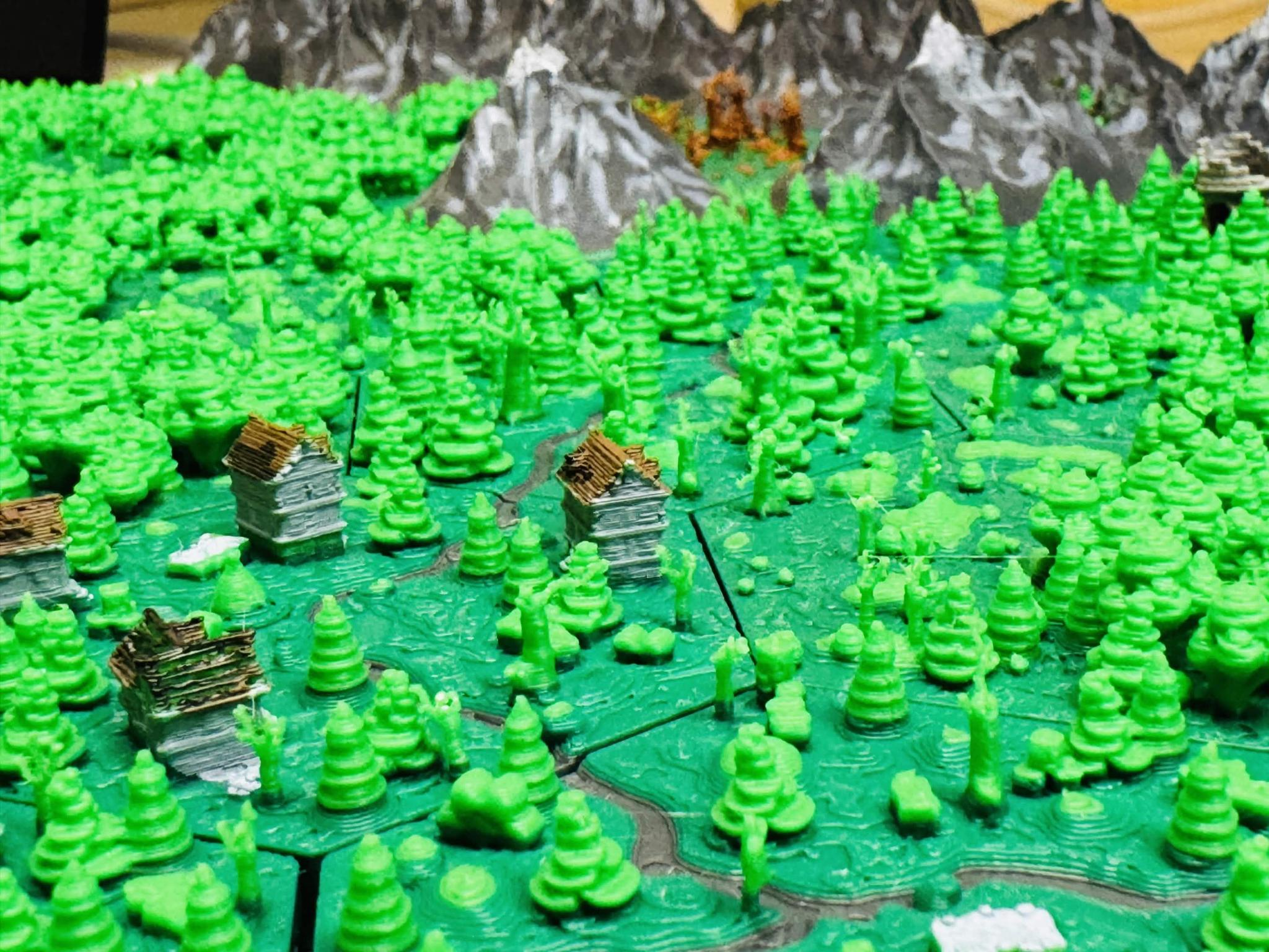 Fantasy 3D map for a TTRPG in a tilt-shift like perspective.

One can see that the scenario is built from hex tiles. In the map you see roads, buildings, forrests and mountains in the background.