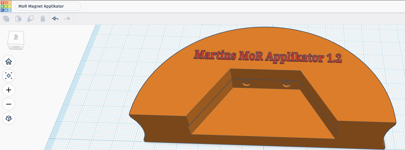 * Overall shape
    * The body is a thick semi-circular (half-disc) base.
    * It appears to be designed as a handheld tool, with plenty of material to grip.
* Central opening
    * A large trapezoidal/U-shaped cutout removes material from the center.
    * This opening probably allows the tool to fit around another object while keeping the outer frame rigid.
* Raised guide walls
    * Along the cutout are vertical guide walls, forming a channel.
    * These walls suggest the tool is intended to locate or constrain another part during assembly.
* Magnet pockets
    * On the inner back wall are two circular recesses.
    * These appear sized to accept cylindrical neodymium magnets.
    * The magnets would likely hold a steel component or another magnetically attracted part in a repeatable position.
* Side contours
    * Both outer ends have concave finger cutouts, making the applicator easier to pick up or grip.
* Thickness
    * The base looks fairly thick, which should provide rigidity and enough depth for embedded magnets.
* Label
    * The top surface is embossed (or engraved) with:
        “Martins MoR Applikator 1.2”
    * Including a version number is a nice touch for printed tools, since they tend to evolve.