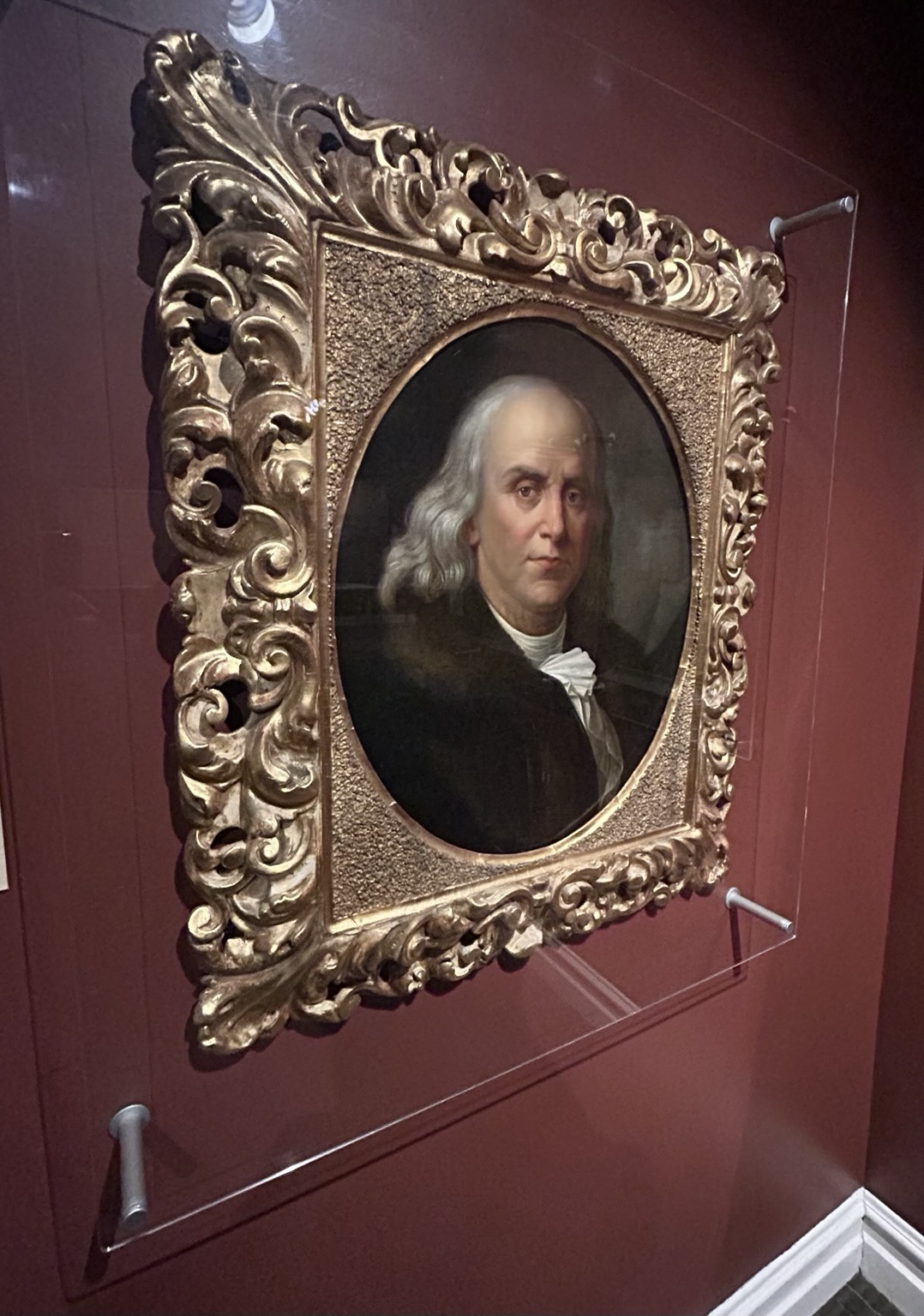 Portrait of Ben Franklin inside, one of many portraits of the 18th and 19th century notables touring through, trying to influence the region.