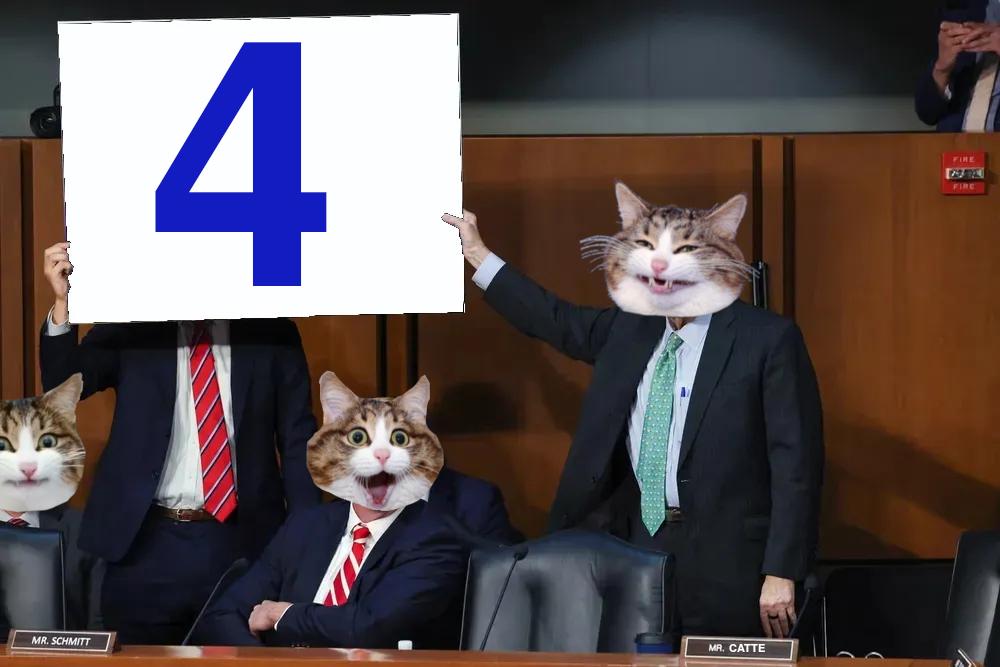 An unnamed ( because fuck them all ) group of politicians with catte heads in a hearing where a couple are holding up a poster of the number 4.