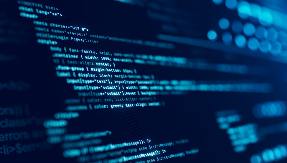 A Shutterstock photo showing a computer screen from the side. The screen background is dark blue, and the text is light blue. The text is HTML and PHP code.