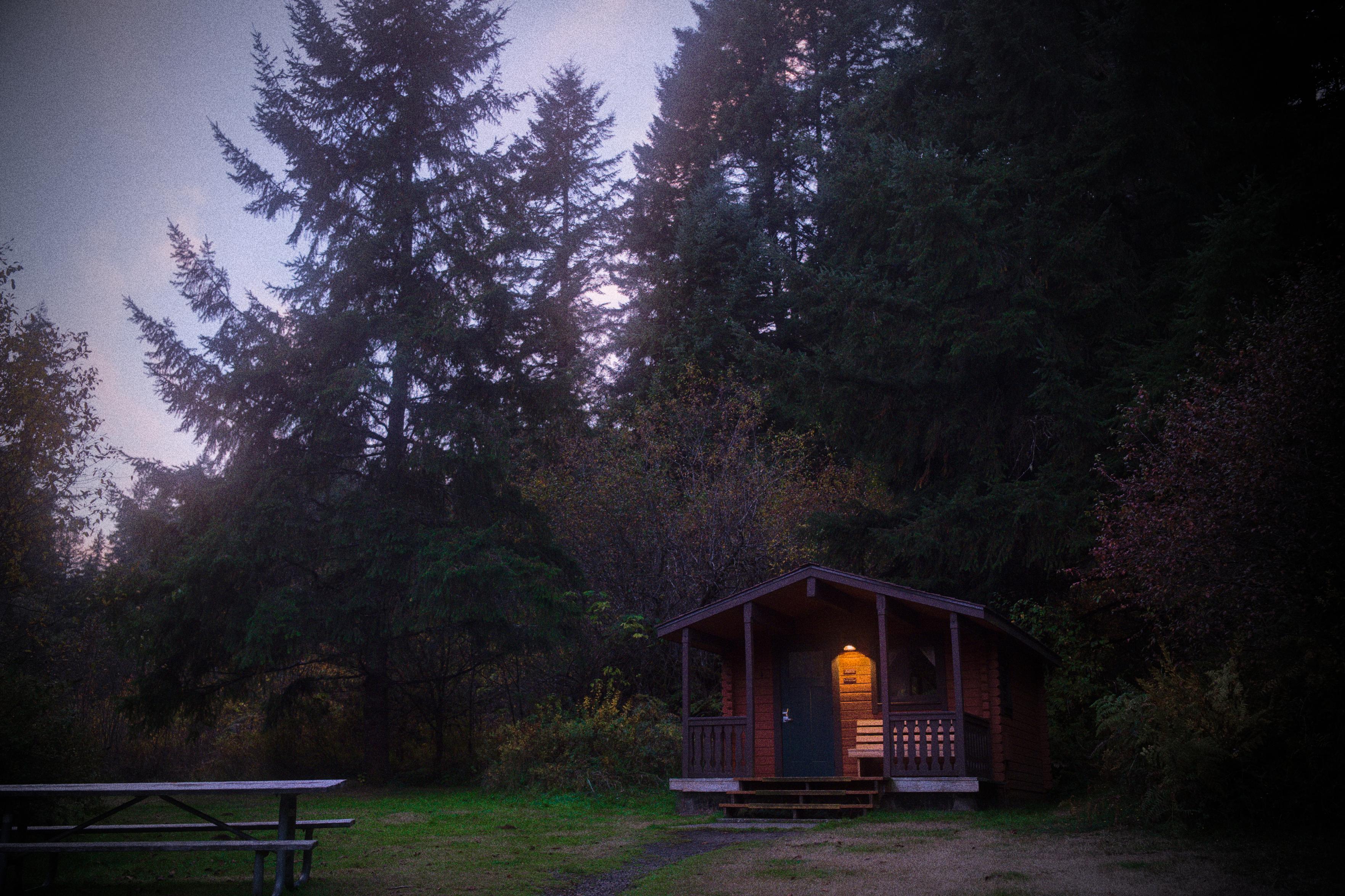a cabin at a campground in the woods